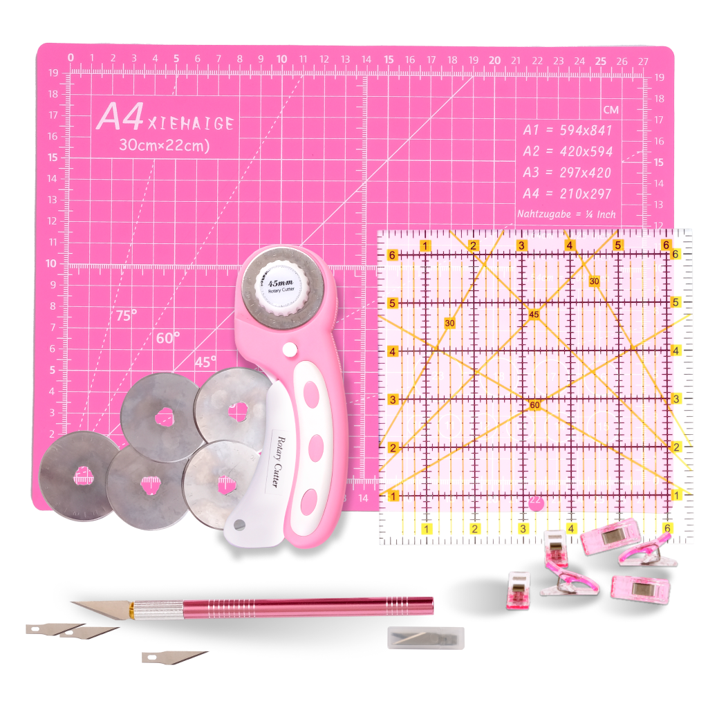 The 39-Piece Quilting Kit: Perfect for Beginners includes a pink cutting mat, rotary cutter with spare blades, square ruler, craft knife, fabric clips, and more—everything a new quilter needs in one organized set.